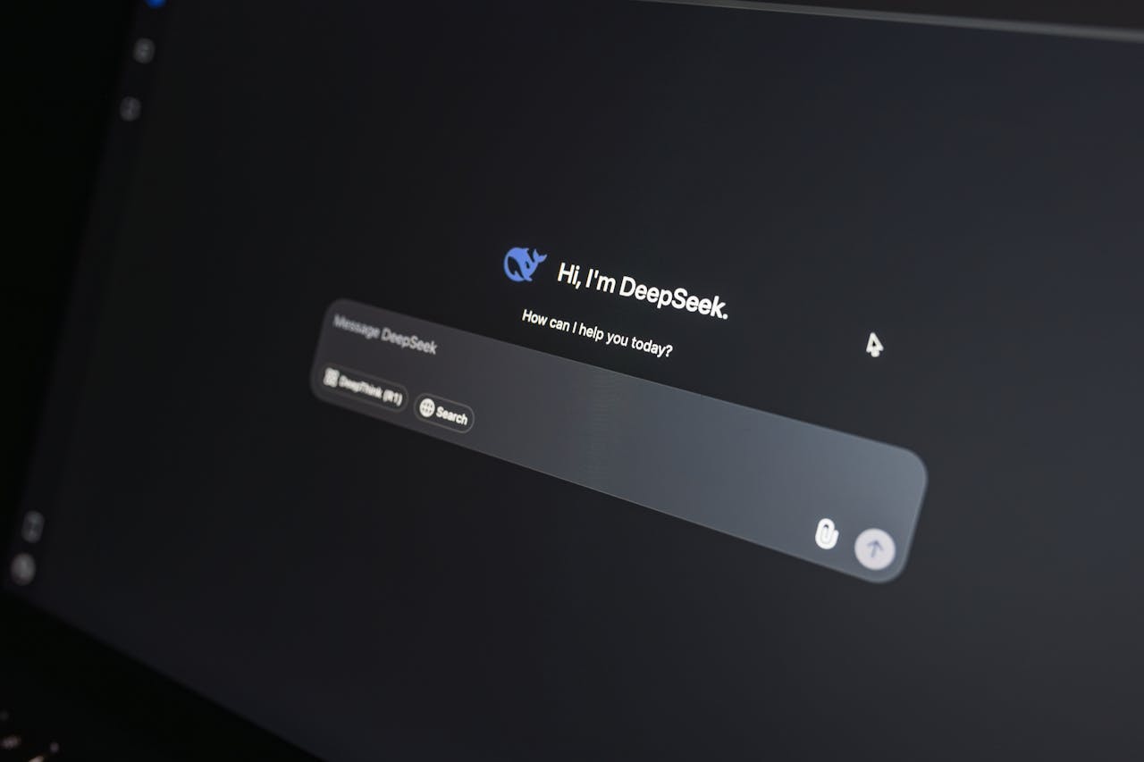 about-us-02 Close-up of DeepSeek AI chat interface on a laptop screen in low light.